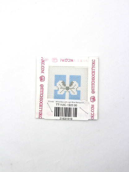 TT112C - White Bow with Light Blue Background Canvas